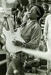 Jimi Hendrix performing on stage Ph