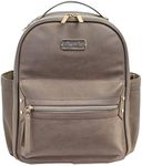 Itzy Ritzy Mini Diaper Bag Backpack with Vegan Leather Changing Pad, 8 Total Pockets (4 Internal and 4 External), Chic Grab-Top Handle and Rubber Feet, Taupe