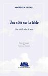 UNE CÔTE SUR LA TABLE (UNA COSTILLA SOBRE LA MESA)