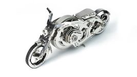 Model of a Bike for self-Assembly “Chrome Rider”, TM “Time for Machine”. Material: Stainless Steel. Wind-up Moving Mechanism. Model Dimensions: 150х67х60 mm. 90 Pieces.