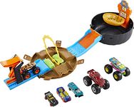 Hot Wheels Toy Monster Trucks Playset, Tire-Shaped Case Transforms into Race Course, 3 Trucks & 4 Cars in 1:64 Scale, Stunt Tire (Amazon Exclusive)