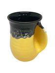 Clay in Motion Handwarmer Mug Yellow and Black Right Hand