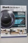 Shark ION Robot Vacuum RV761 with Wi-Fi and Voice Control, 0.5 Quarts, in Black and Navy Blue