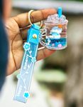 TERA 13 Liquid Floating Cute keychains Bag Charm, Wristlet Bracelet Key Ring for Women Girl, Moving Sand Bottle Sipper Keychain Return Gift For Kids 1pcs