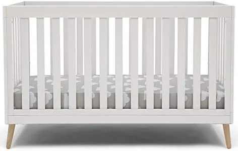 Delta Children Essex 4-in-1 Convertible Baby Crib, Bianca White with Natural Legs