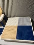 lego table with storage and chairs. ONLY HAS THREE LEGS FOR THE TABLE