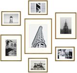 Frametory, Aluminum Gallery Wall Frame Set with Ivory Color Mat - 7 Pack of Metal Picture Frames with Real Glass - Four 5x7, Two 8x10, One 11x14 - Great for Photos, Artworks, Posters (Bronze)