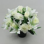 Beautiful white artificial flower arrangement in grave/memorial pot