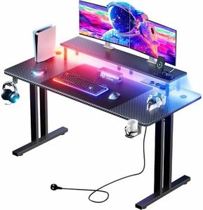 HLONONE Gaming Tisch mit LED, 140x60 cm Gaming Schreibtisch mit 3 Steckdosen und 2 USB Anschlüssen, PC Gamer Tisch mit Monitorständer, Stabiler Computertisch für Gaming und Büro, Schwarz
