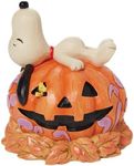 Enesco Peanuts by Jim Shore Halloween Snoopy Laying on Carved Pumpkin Figurine, 5.5 Inch, Multicolor