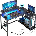 Bestier Small L Shaped Gaming Desk with Power Outlets, 42 inch Computer Desk with Storage Shelves Reversible Corner Gamer Desk with Monitor Stand & Headset Hooks Carbon Fiber Black