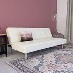 DHP Nola Futon Couch with Tufted Faux Leather Upholstery, Modern Style, White Faux Leather