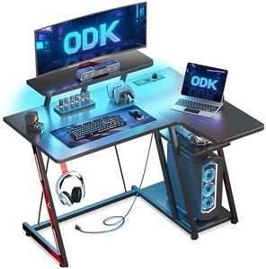 ODK Mesa Gaming Esquina con Luces LED y Tomas de Corriente, Escritorio Gaming L con Soporte para Monitor, Mesa Gamer con Estante de Almacenamiento Fibra de Carbono Negro 100x70 cm