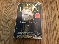 Death in a Strange Country: A Commissario Guido Brunetti Mystery