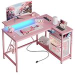 Bestier Small L Shaped Gaming Desk with Power Outlets, 42 inch Computer Desk with Storage Shelves Reversible Corner Gamer Desk with Monitor Stand & Headset Hooks Carbon Fiber Pink