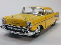 Kinsmart Canary Yellow 1957 Chevy Bel Air 2 Door Coupe 1/40 O Scale Diecast Car by Kinsmart