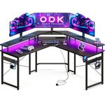 ODK Gaming Desk with LED Lights, Corner Gaming Desk with 2 Sockets and 2 USB Charging Ports, L Shaped Gaming Desk with Monitor Stand, Black Carbon Fiber, 129 x 129 cm