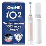 Oral-B iO2 Electric Toothbrush, 1 Gentle Care Toothbrush Head, 1 Travel Case, 1 Travel Refill Holder, Toothbrush for Adults (Calm Pink), Designed by Braun, 2 Pin Plug