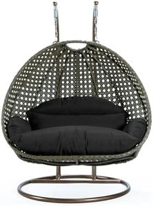 LeisureMod Black Wicker 2 Person Egg Swing Chair with Beige Stand and Cushions – Double Hanging Hammock Lounge for Patio, Indoor & Outdoor Use