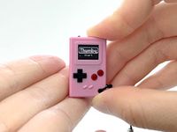 TinyCircuits Thumby (Pink), Tiny Game Console, Playable Programmable Keychain: Electronic Miniature, STEM Learning Tool