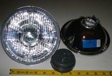 Hella 7" Round E Code H4 Halogen Replacement Headlight Kit with Standard 60/55W H4 Bulbs