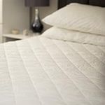 UK Care Direct Luxury 200TC Cotton Mattress Protector with Deep Skirt - Quilted Casing and Ultra Soft Hollowfibre Filling - Fitted Sheet for Secure Fit - Quality Cotton Cover - EMPEROR - 200cm x 200cm