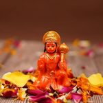 Zig Zag Hanuman Ji Idol in Blessing Posture with Gada – Sitting Lord Balaji Bajrangbali Sankat Mochan Bhagwan Idol for Temple, Car Dashboard, Home Decor, Statue Gift – 8L x 6W x 6H cm, Orange