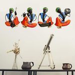 eCraftIndia Set of 4 Tribal Man Playing Different Musical Instruments Wall Hanging
