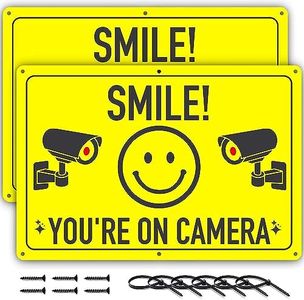 ASSURED SIGNS Smile You're On Camera Sign - 2 Pack - 11.75 X 8 Inch - Ideal Aluminum Video Surveillance Security Signs to Prevent Trespassing on Private Property - Perfect for House, Business, Yard or Private Driveway