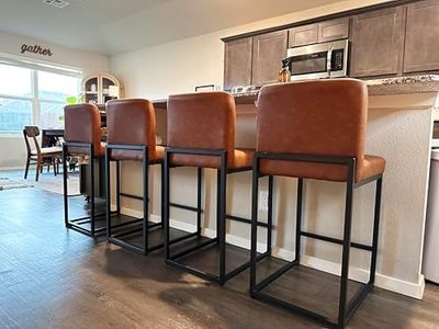 ALPHA HOME 24” Bar Stools Set of 4 Counter Height Bar Stool Pu Leather Kitchen Modern Bar Stools with Backrest Upholstered Footrest Sturdy Chromed Metal Steel Frame,Brown.