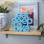 NUKKAD TALES Eat Sleep Bike Blue Quirky Showpiece Home Decor Items for Living Room Decorative Items for Book Shelf Birthday Gift Items Gift for Bike Lovers (6 X 5.4 inch)