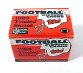 1989 Topps Traded Football Complete Mint 132 Card Set in Original Factory Set Box. Featuring Rookie Cards of Barry Sanders, Troy Aikman, Derrick Thomas, Deion Sanders and Many Others