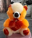 Toys Guru Yellow Teddy Bear with Red Love Heart 2 Feet Multicolor Teddy Bear for Playing Kids Babies Girls and Boy for Birthday Wedding Anniversaries and Valentines Day Gifts (Yellow, 2 Feet)