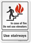 SmartSign Adhesive Vinyl Label, Legend "in Case of Fire Do Not Use Elevators" with Graphic, 7" high x 5" Wide, Black/Red on White