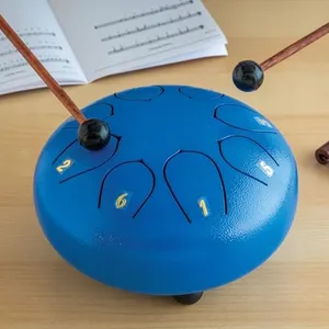 Eight Note Steel Tongue Drum Kit - Metal African musical Instrument - 6" steel tongue drum, songbook with instructions, set of stickers, 2 wooden mallets, 1 mallet holder, and a carrying bag.