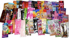 50 NEW ASSORTED INDOOR TANNING BED LOTION PACKETS SAMPLES PACKETTES by Unknown