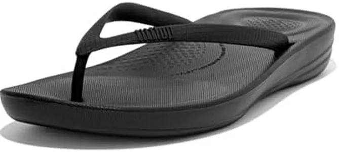 FitFlop Women's iQushion Rubber Flip-Flips with Contoured Footbed for Walking, Lightweight Ergonomic Flip Flop Sandals with Arch Support and Foot Impact Pillows, All Black, 5 US Women