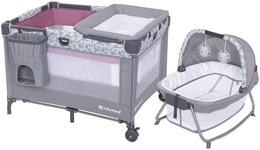 Baby Trend Nursery Den Playard with with Rocking Cradle, Snooze Pod, Flip Over Changer, Daisy Pink