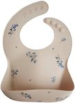 Mushie Baby Silicone Bib | Adjustable Fit Waterproof Bibs | Easy Wipe Baby Feeding Bibs | 4 Adjustable Sizes with Deep Front Pockets | 100% BPA and Phthalate Free (Lilac Flowers)