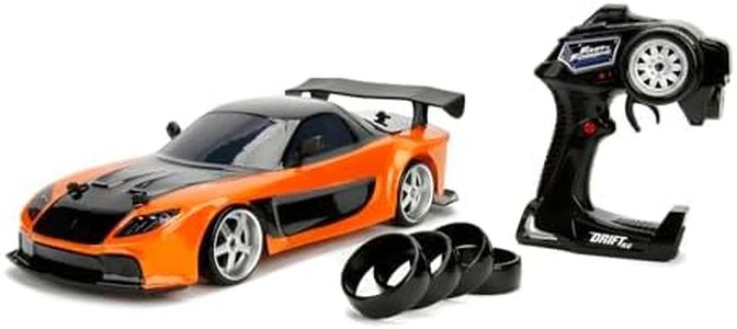 JADA 253209001 Fast And The Furious Toys Fast & Furious Mazda RX-7 RC Car with Radio Remote Control, Drift Function, 4 Tyres, USB Charging, Scale 1:10, Orange